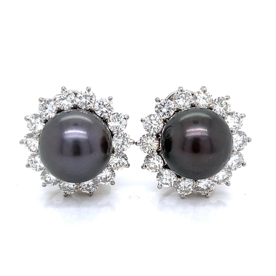18K White Gold Black South Sea Pearl Diamond Clip Earrings: 18K White Gold Black South Sea Pearl Diamond Clip Earrings These stunning clip earrings feature exquisite 18K white gold, elegantly adorned with two luxurious Black South Sea pearls, measuring 12.6mm 
