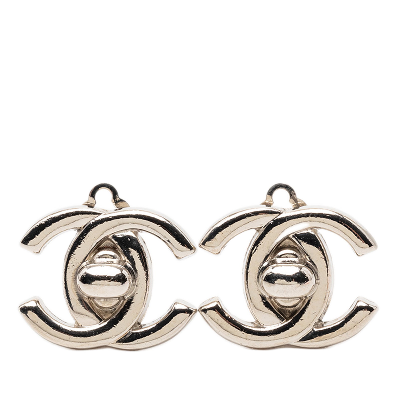 Chanel CC Logo Silver Plated Clip-On Turnlock Earrings: Chanel CC Logo Silver Plated Clip-On Turnlock Earrings These Chanel clip-on earrings feature silver-plated metal bodies with CC turnlock detailing. Designed as costume jewelry, they offer a classic st