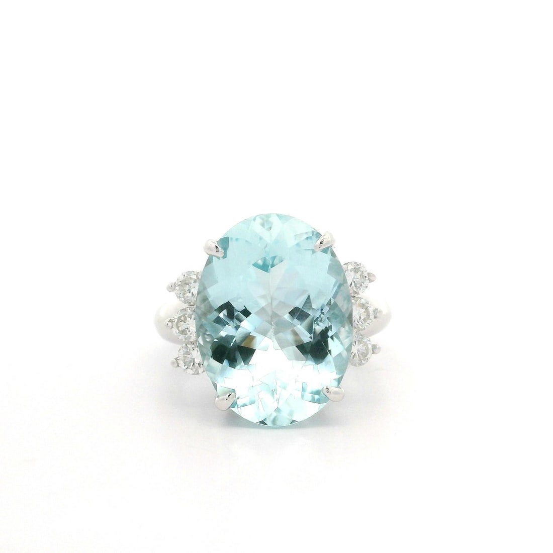 Platinum 7.65ctw Oval Aquamarine Diamond Cocktail Ring: Platinum 7.65ctw Oval Aquamarine Diamond Cocktail Ring Make a statement with this stunning cocktail ring featuring a large oval aquamarine surrounded by sparkling diamonds. The main stone is a natural