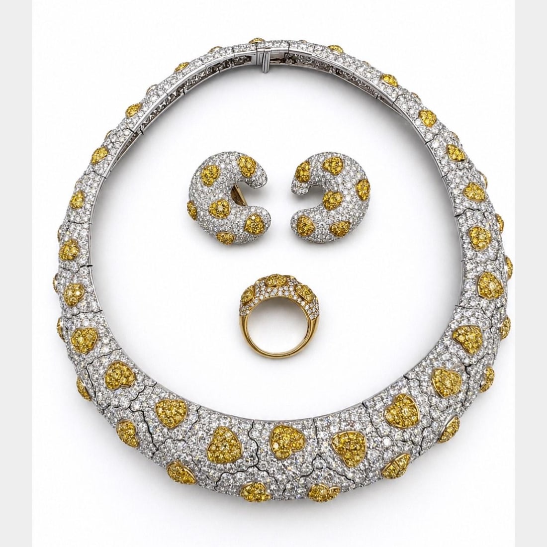 GIA Certified Fancy Yellow Diamond Jewelry Suite 18K Gold: GIA Certified Fancy Yellow Diamond Jewelry Suite 18K Gold This French jewelry set is crafted from 18K yellow and white gold and includes a necklace, ring, and earrings. The set features approximately 