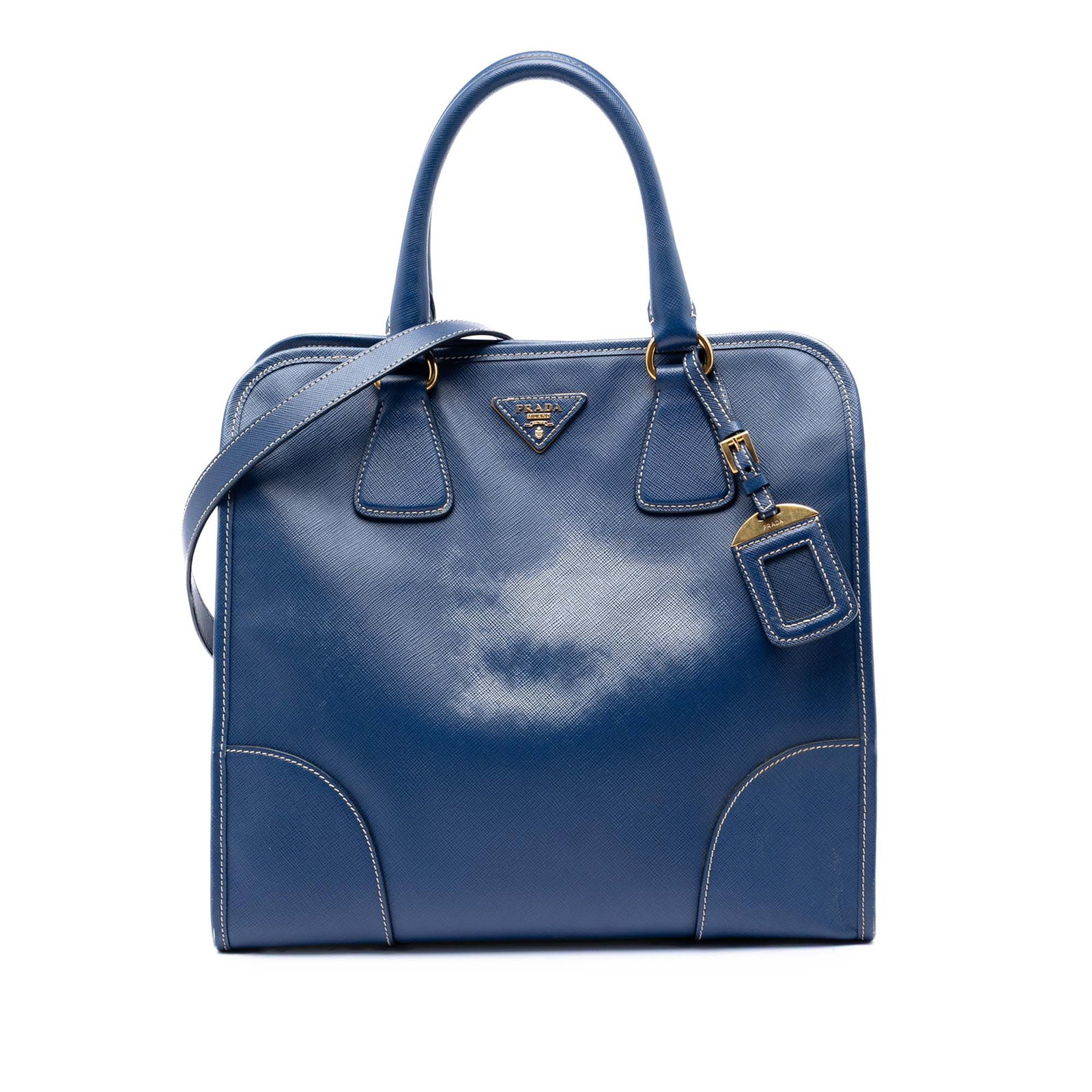 Prada blue leather Saffiano Lux Shopping Tote bag: Prada blue leather Saffiano Lux Shopping Tote bag This Prada Saffiano Lux Shopping Tote is crafted from blue saffiano leather and features rolled leather handles, a detachable and adjustable flat leat