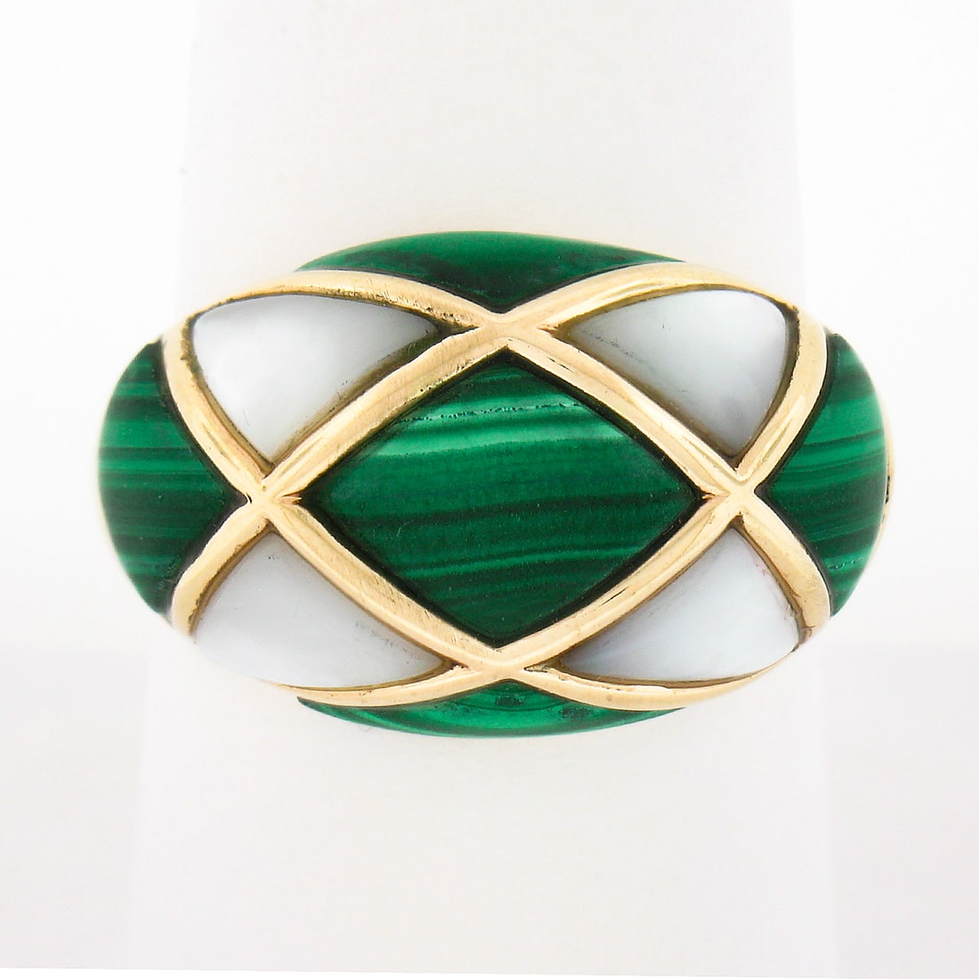 Wide Bombe Dome Ring in 14K Yellow Gold with Malachite and Mother of Pearl Inlay: Wide Bombe Dome Ring in 14K Yellow Gold with Malachite and Mother of Pearl Inlay This vintage wide domed bombe ring is crafted from solid 14K yellow gold and features an inlaid design with five natura