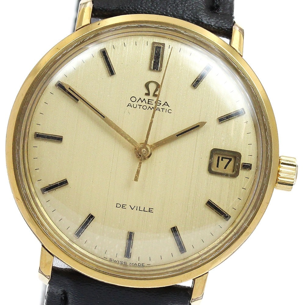 Omega De Ville automatic date men's wristwatch gold dial: Omega De Ville automatic date men's wristwatch gold dial This Omega De Ville Date men's wristwatch features a stainless steel and gold-plated case with a gold-tone dial. It is equipped with an automat