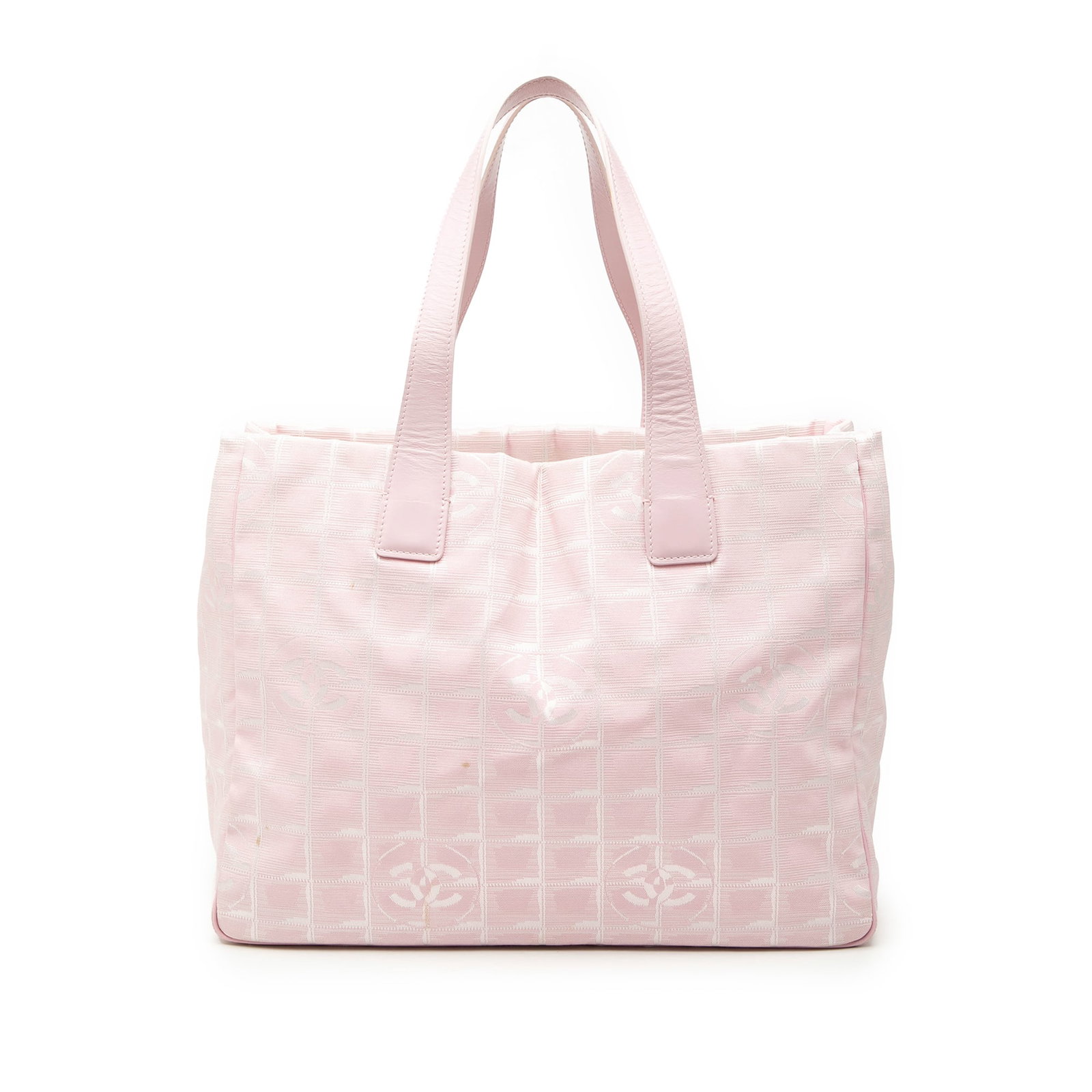 Chanel pink nylon leather trim tote New Travel Line: Chanel pink nylon leather trim tote New Travel Line This Chanel New Travel Line Nylon Tote features a pink nylon body complemented by leather trim and flat leather straps. The bag is designed with an 