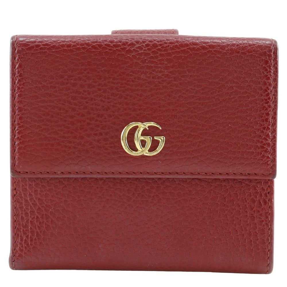 Red Leather GG Marmont Bifold Wallet by Gucci Italy: Red Leather GG Marmont Bifold Wallet by Gucci Italy This Gucci GG Marmont bifold wallet is crafted from red leather and designed for women. The wallet features a compact and functional style with a cl