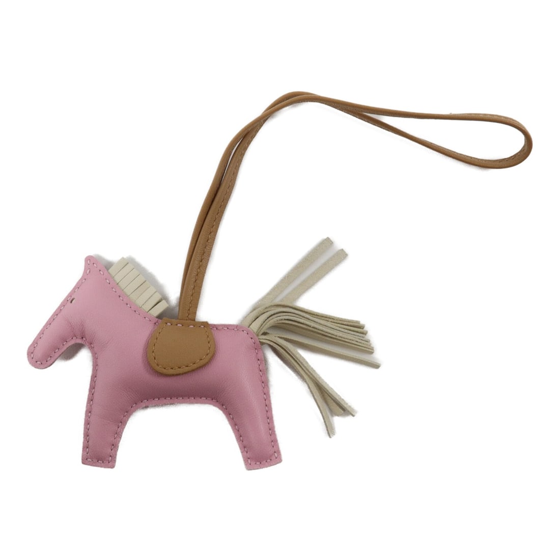 Hermes Rodeo PM Milo Leather Charm Pink: Hermes Rodeo PM Milo Leather Charm Pink This Hermes Rodeo PM Charm is crafted from Milo lambskin leather in a combination of Sylvestre, Chai, and Craie colors. Designed as a stylish accessory, it is s
