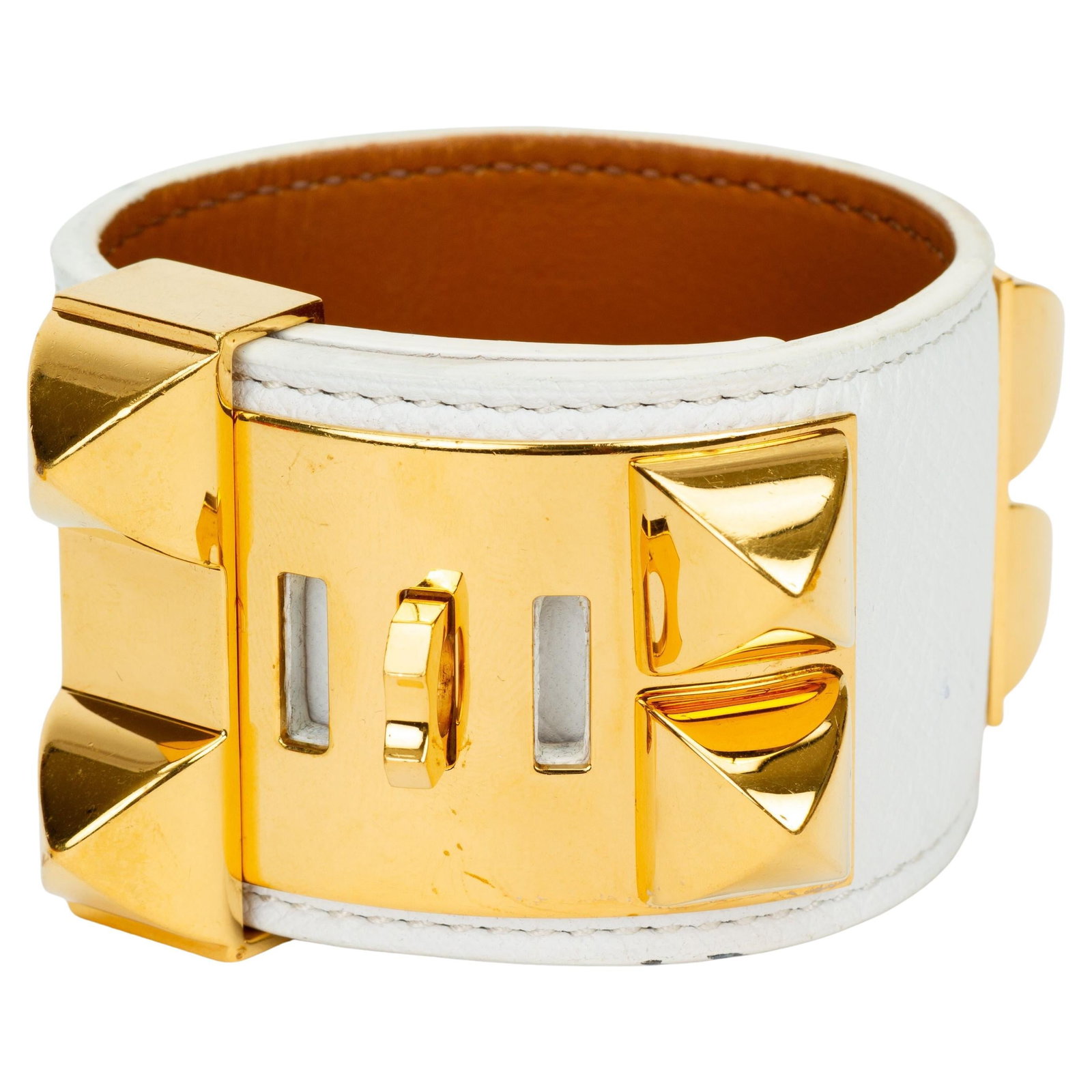 White Swift Leather Collier de Chien Bracelet with Gold Tone Hardware by Hermes: White Swift Leather Collier de Chien Bracelet with Gold Tone Hardware by Hermes This Hermes Collier de Chien bracelet features white swift leather accented with gold-tone hardware, including signature
