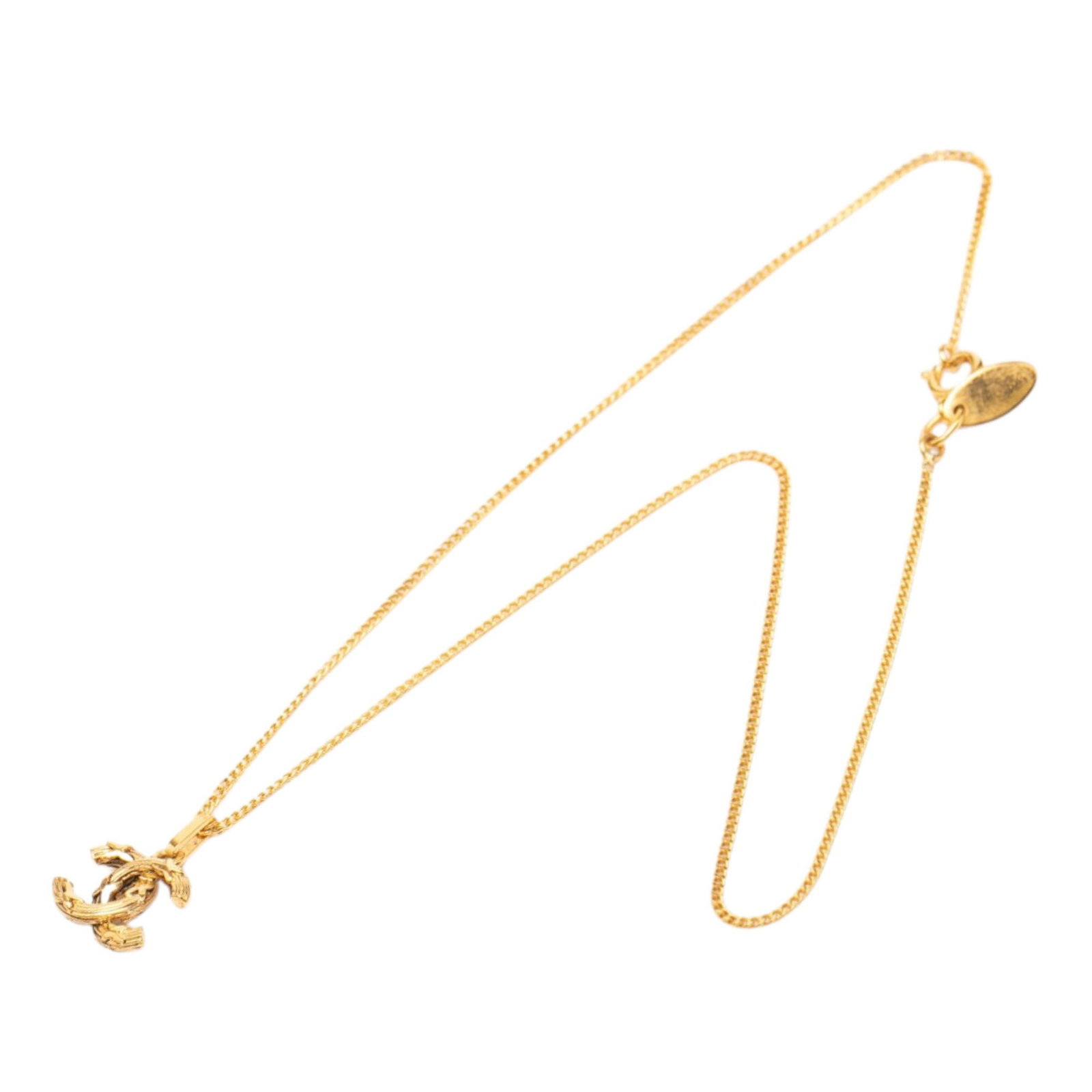 Chanel CC Logo Pendant Necklace Gold Tone Chain: Chanel CC Logo Pendant Necklace Gold Tone Chain This Chanel necklace features a gold-tone chain with a signature CC pendant and spring ring closure. Crafted from metal, it is categorized as costume je