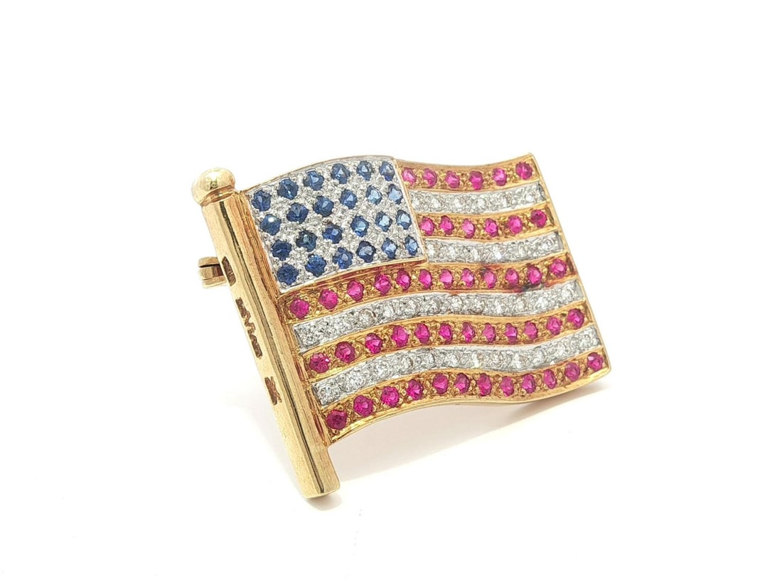 18k Yellow Gold American Flag Brooch With Rubies Sapphires and Diamonds: 18k Yellow Gold American Flag Brooch With Rubies Sapphires and Diamonds This vintage American flag pin brooch features natural round brilliant cut rubies, sapphires, and diamonds set in solid 18k yell