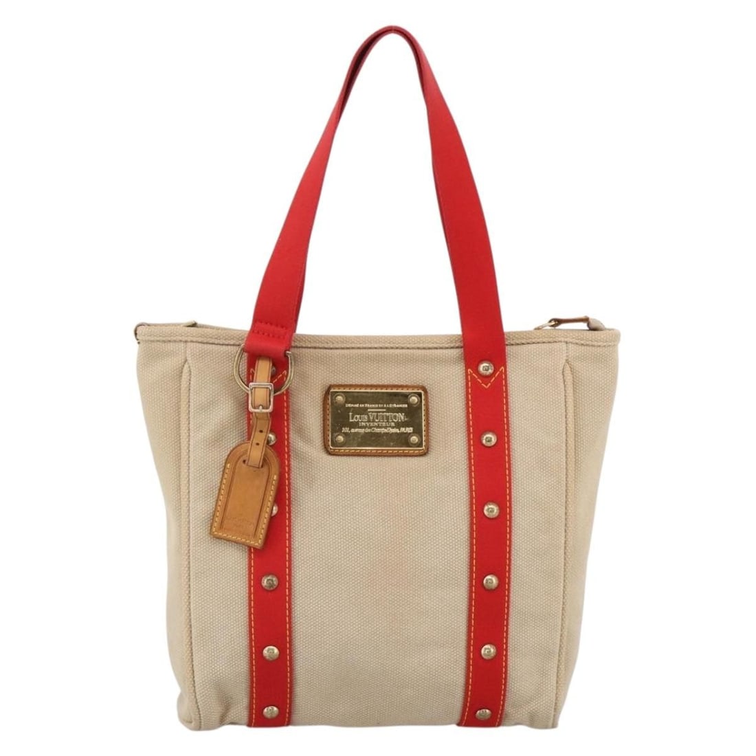 Louis Vuitton Antigua Beige Canvas Tote Bag France: Louis Vuitton Antigua Beige Canvas Tote Bag France This Louis Vuitton Antigua Tote features a beige canvas exterior with leather accents and is designed for women. The bag includes metal fittings and 