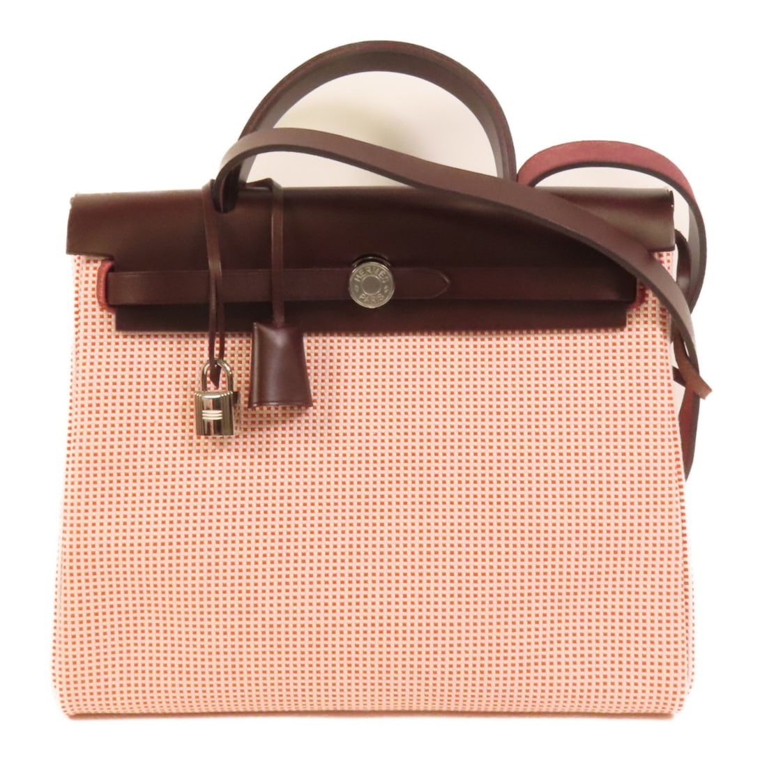 Herbag PM Canvas Shoulder Bag with Palladium Hardware by Hermes: Herbag PM Canvas Shoulder Bag with Palladium Hardware by Hermes This Hermes Herbag PM is a versatile 2-way shoulder handbag crafted from canvas in a striking red color. Designed for women, the bag fea