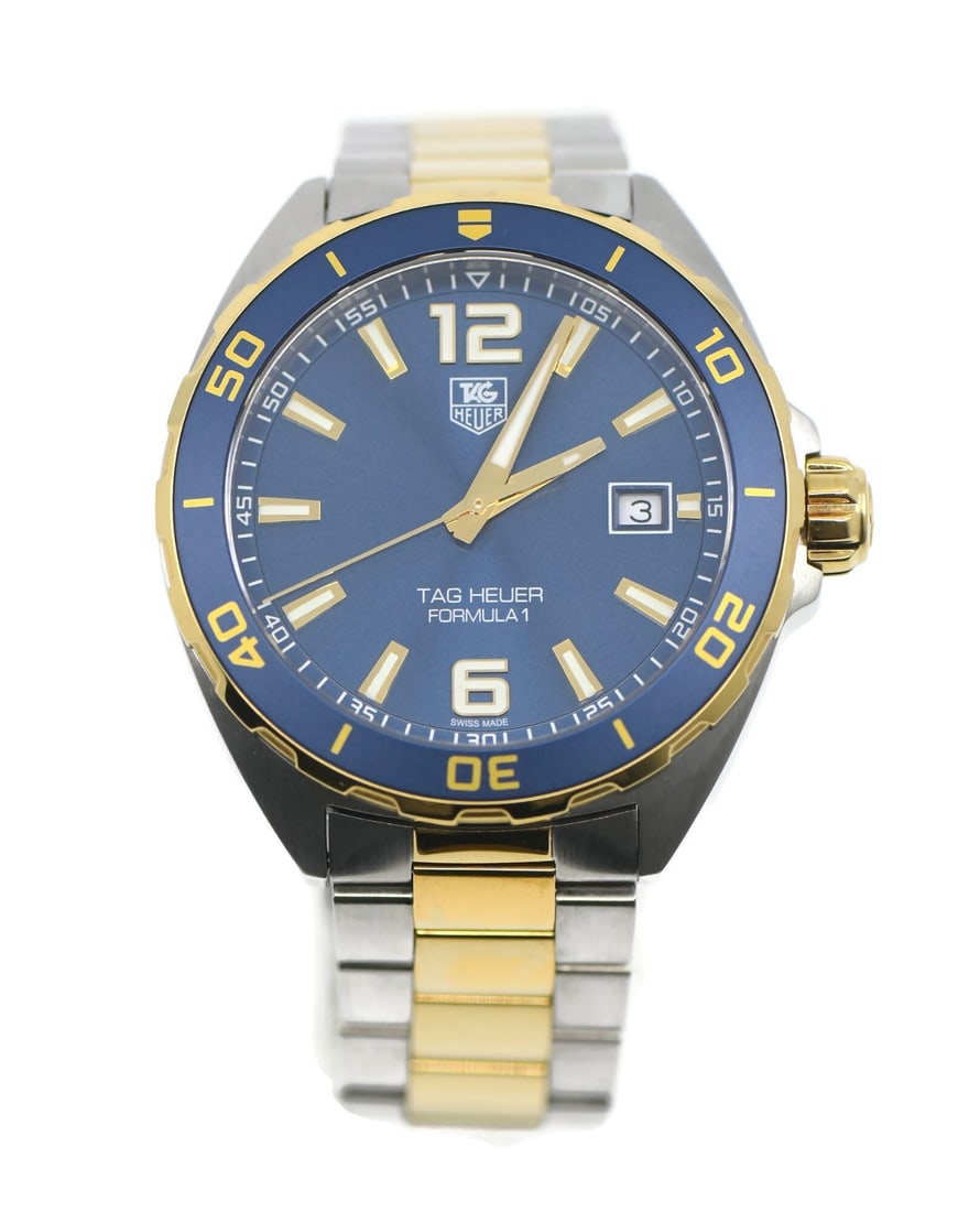 TAG Heuer Formula 1 Blue Dial Steel Bracelet Watch WAZ1120: TAG Heuer Formula 1 Blue Dial Steel Bracelet Watch WAZ1120 This TAG Heuer Formula 1 wristwatch features a 41mm stainless steel case with a blue analog dial and unidirectional rotating bezel. It is pow