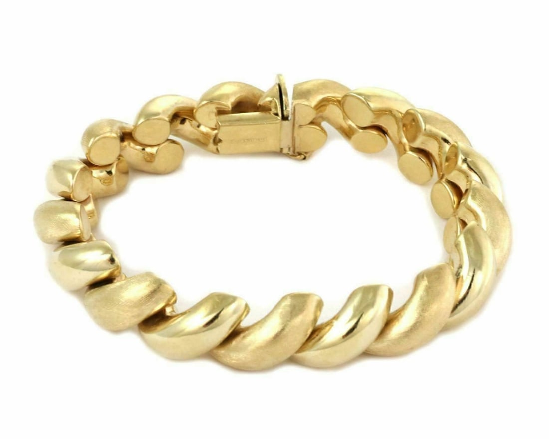 14k Yellow Gold San Marco Link Bracelet Italy: 14k Yellow Gold San Marco Link Bracelet Italy This vintage San Marco macaroni link bracelet is crafted in Italy from 14k yellow gold. Featuring the iconic smooth, dimensional macaroni links, it offers