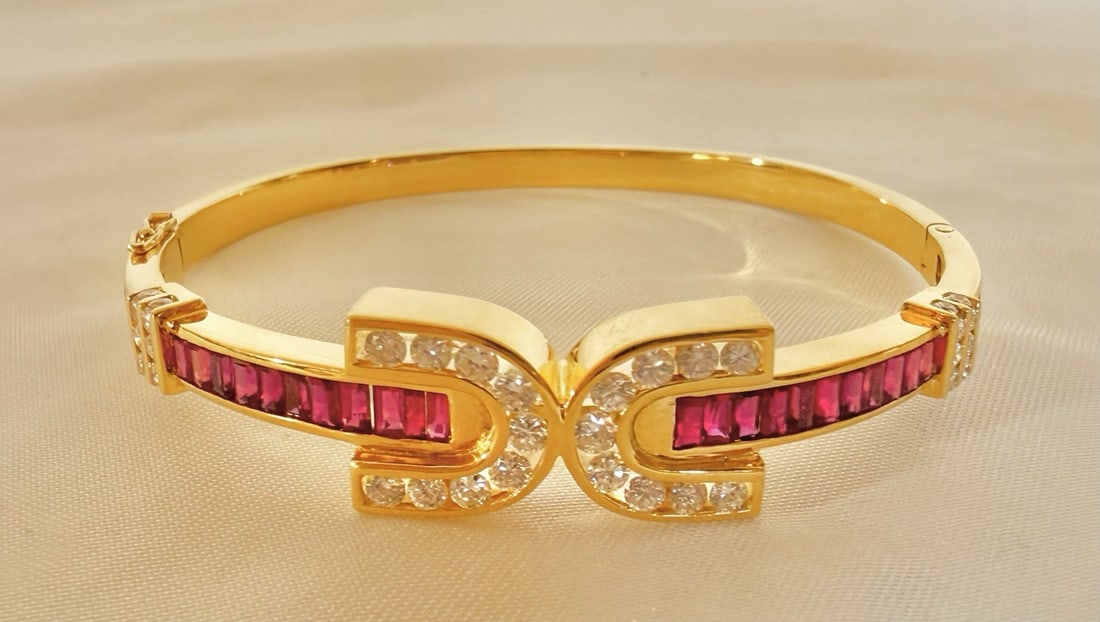 French 18K Yellow Gold Cuff Bracelet with Rubies and Diamonds: French 18K Yellow Gold Cuff Bracelet with Rubies and Diamonds This French bracelet is crafted from 18K yellow gold and features a cuff style adorned with approximately 3.00 carats of rubies and 1.00 c