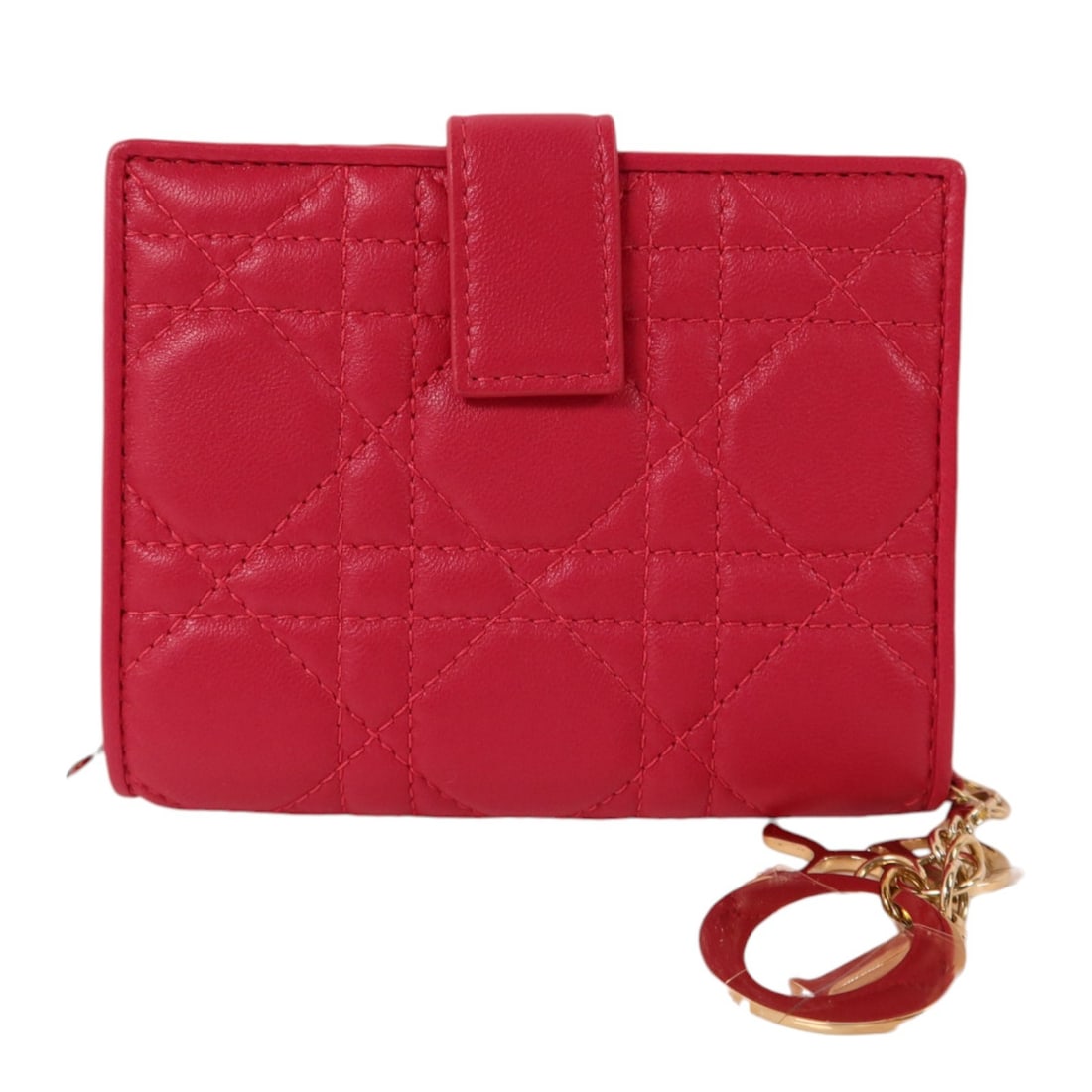 Dior Lady Dior Pink Lambskin Bi-fold Wallet: Dior Lady Dior Pink Lambskin Bi-fold Wallet This Christian Dior Lady Dior bi-fold wallet is crafted from luxurious pink lambskin leather, offering a stylish and sophisticated accessory for women. Made