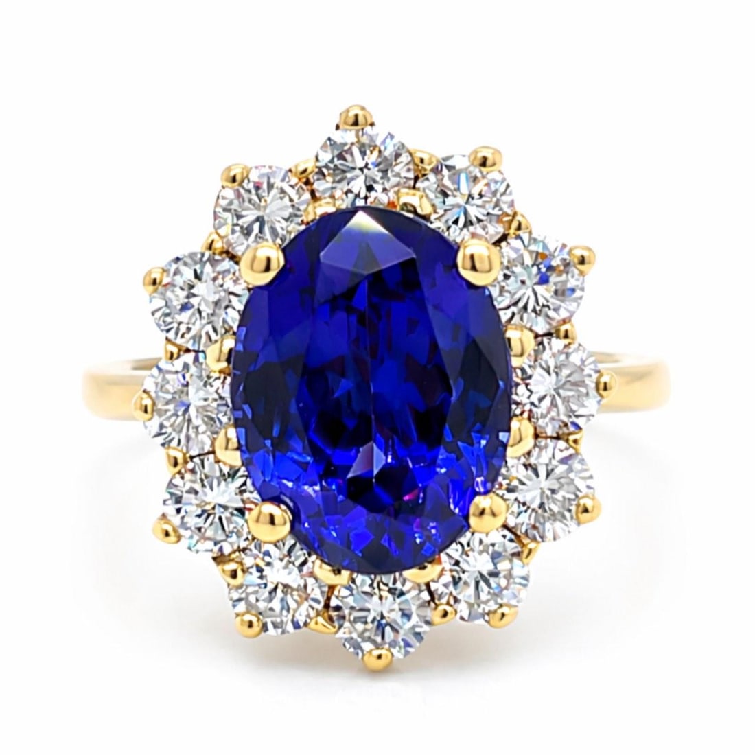 GIA 4.61 Ct Tanzanite and Diamond 18K Yellow Gold Ring Size 7: GIA 4.61 Ct Tanzanite and Diamond 18K Yellow Gold Ring Size 7 This elegant ring is crafted from 18K yellow gold and features a GIA certified tanzanite weighing 4.61 carats. Accentuating the centerpiec