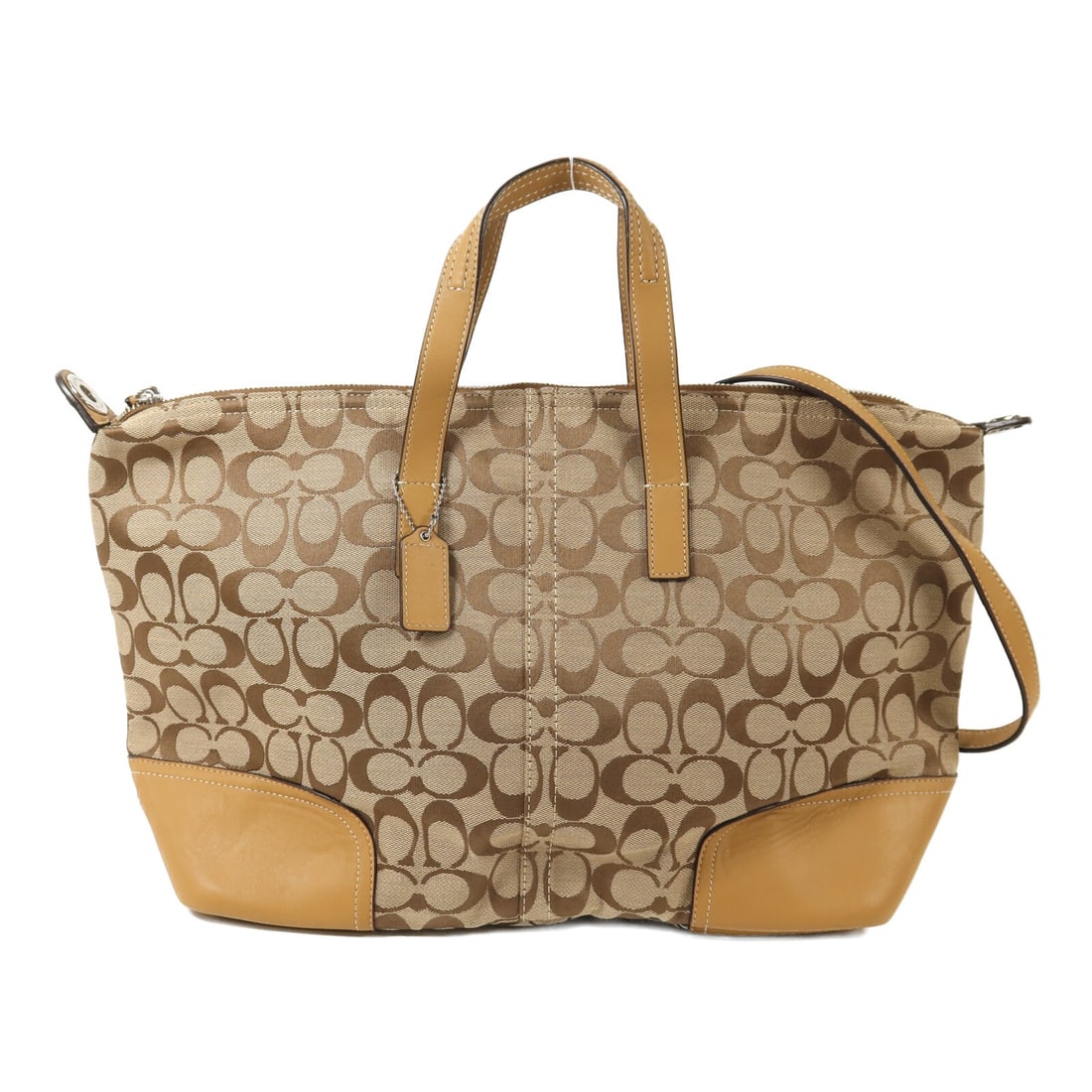 Coach Canvas Brown Two Way Convertible Shoulder Bag: Coach Canvas Brown Two Way Convertible Shoulder Bag This Coach 2-way shoulder bag is crafted from brown canvas and features a versatile design suitable for various styles. Designed for women, it offer