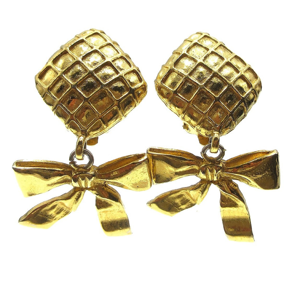 Chanel Gold Quilted Clip-On Dangle Earrings: Chanel Gold Quilted Clip-On Dangle Earrings Elevate your accessory collection with these exquisite Chanel Quilted Bow Dangle Earrings. Crafted in a stunning gold tone, these clip-on earrings feature a