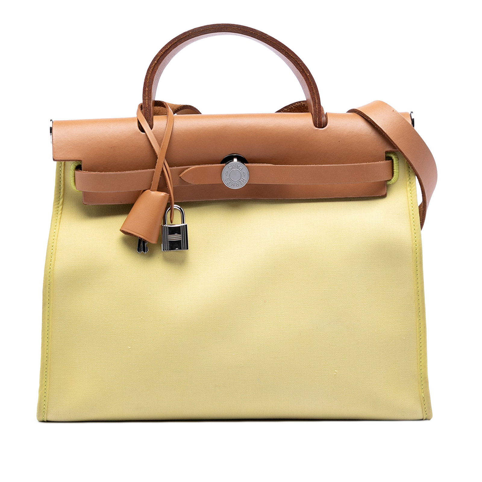 Yellow canvas Herbag Zip 31 shoulder bag by Hermes with leather trim: Yellow canvas Herbag Zip 31 shoulder bag by Hermes with leather trim The Hermes Toile Herbag Zip 31 features a canvas body with a flat leather top handle and a flat leather shoulder strap. It includes