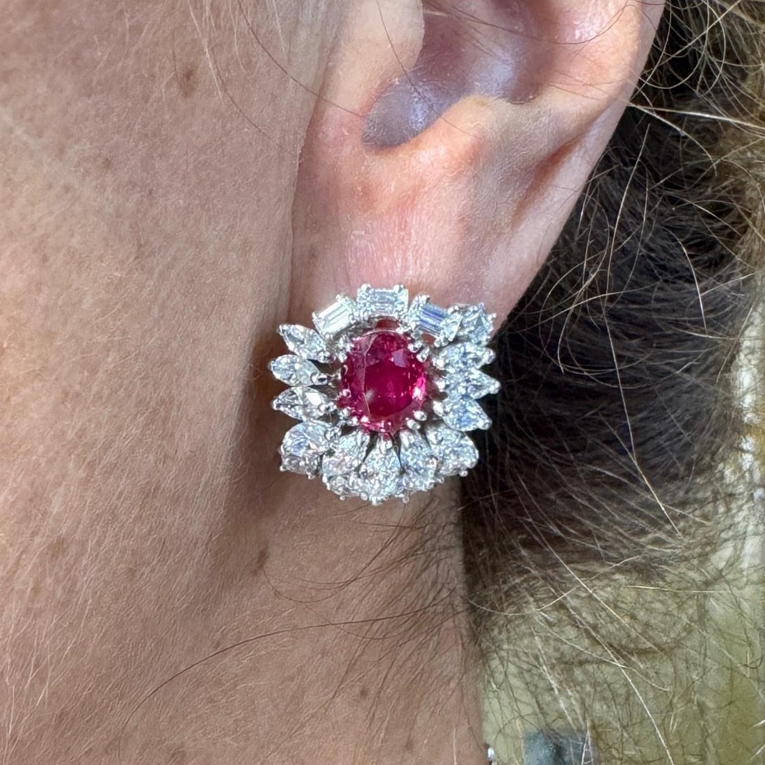 1960s Platinum Earrings with Rubies and Diamonds by FASOLI: 1960s Platinum Earrings with Rubies and Diamonds by FASOLI Elegant earrings from the 1960s crafted in platinum, featuring two rubies with an approximate total weight of 5.00 carats. The earrings are f