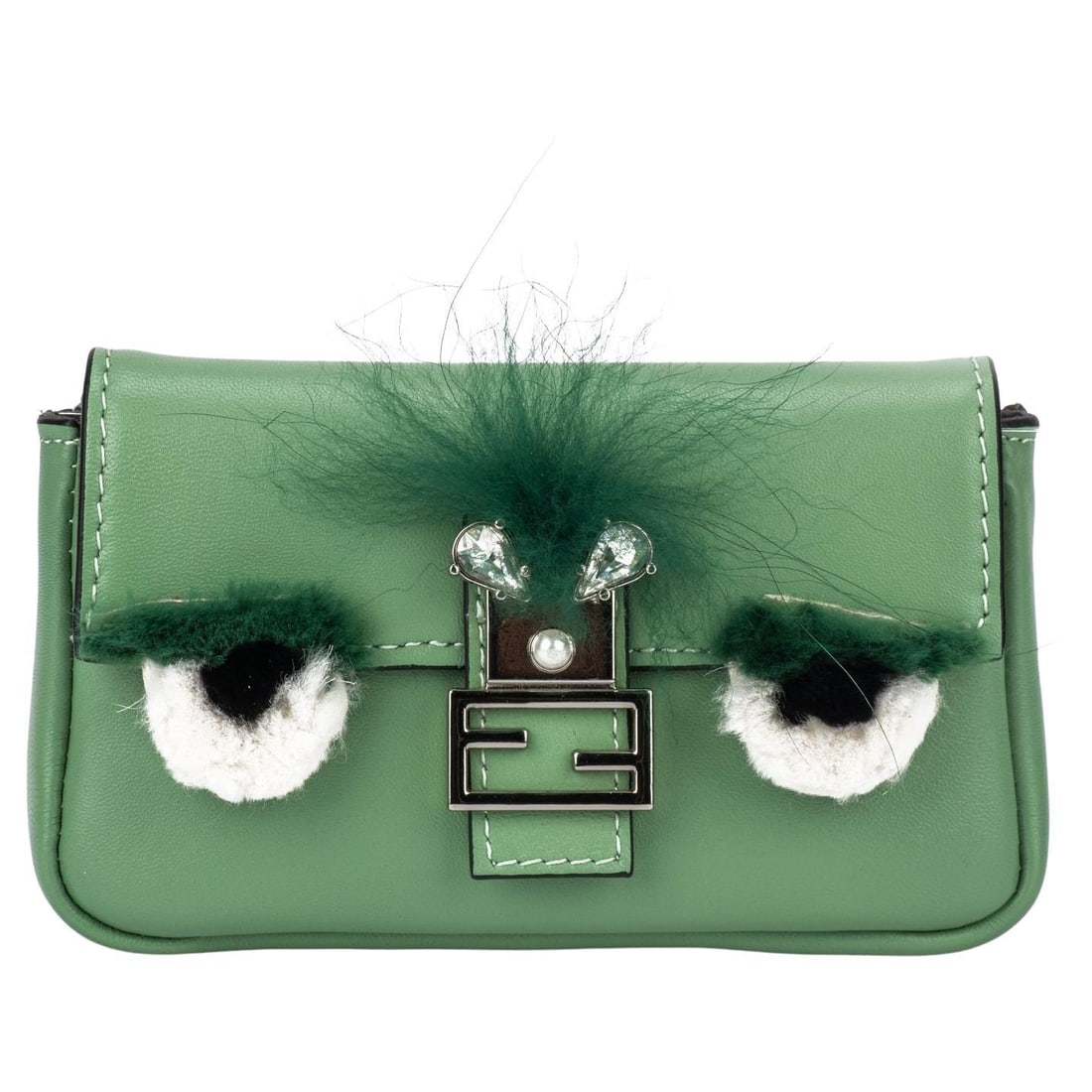 Fendi Moss Green Leather Micro Monster Baguette Crossbody Bag: Fendi Moss Green Leather Micro Monster Baguette Crossbody Bag Introducing the Fendi Leather Micro Monster Baguette, a stylish crossbody bag that showcases exquisite craftsmanship and playful design. T
