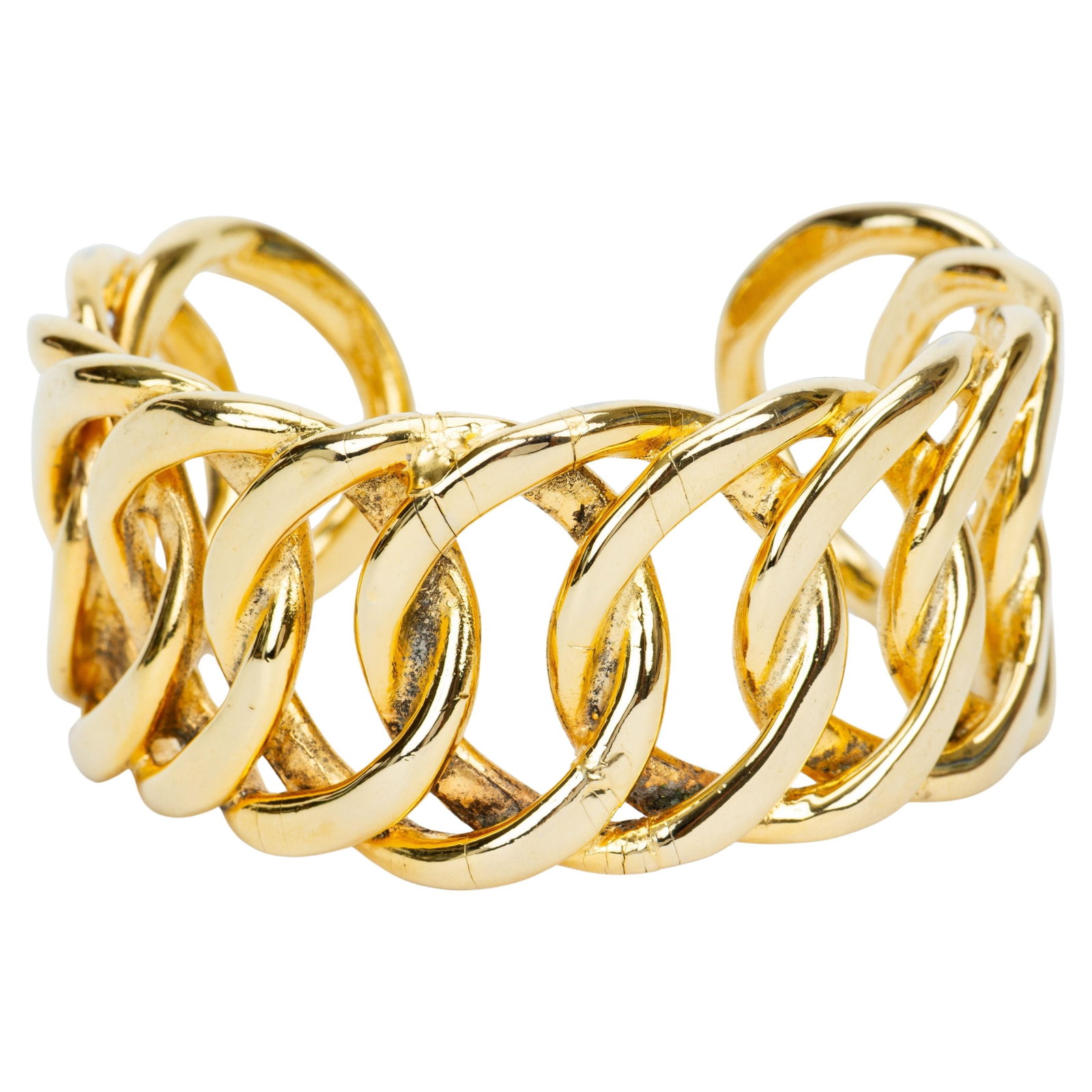 1980s Gold Plated Chain Cuff Bracelet by Chanel: 1980s Gold Plated Chain Cuff Bracelet by Chanel This Chanel chain cuff bracelet from the 1980s features a gold-plated braided metal design. The bracelet is crafted in France and showcases classic Chan