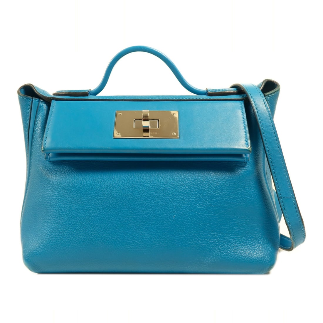 Hermes 24 24 Mini Blue Calfskin 2 Way Shoulder Bag: Hermes 24 24 Mini Blue Calfskin 2 Way Shoulder Bag This Hermes 24/24 Mini 2-way shoulder bag is crafted from Evercolor and Swift calfskin leather in a sophisticated blue shade. Designed for versatilit