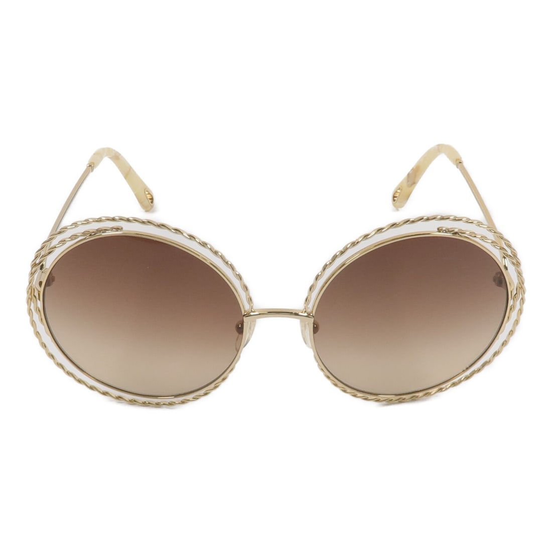 Chloe Carlina Twist Brown Metal Sunglasses: Chloe Carlina Twist Brown Metal Sunglasses These Chloe Carlina Twist sunglasses feature a stylish brown metal frame, offering a sophisticated look for women. Crafted with attention to detail, they are
