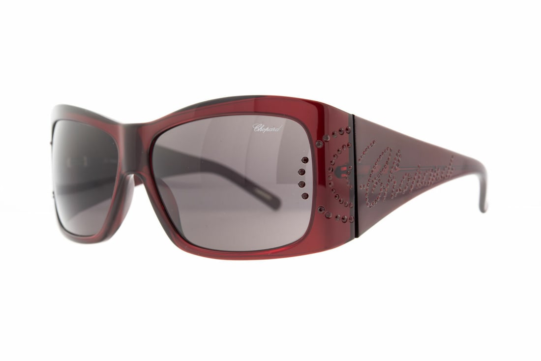 Chopard Eye Couture SCH 033S 954 Women's Sunglasses Cherry Frame Black Lenses: Chopard Eye Couture SCH 033S 954 Women's Sunglasses Cherry Frame Black Lenses Elevate your style with these Chopard Eye Couture SCH 033S 954 Women's Sunglasses. Featuring a striking cherry-colored pla