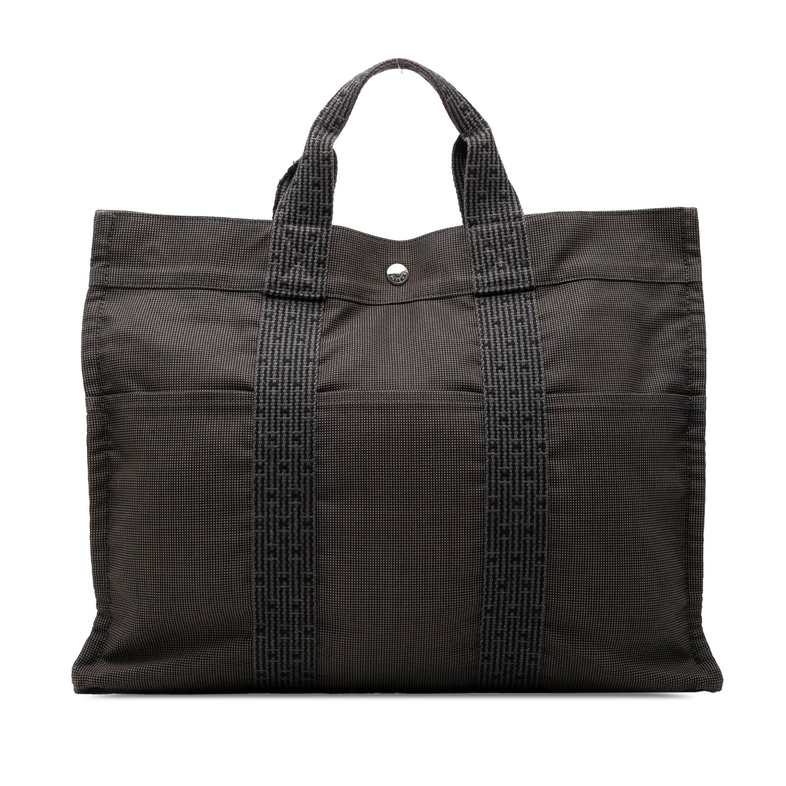 Hermes Herline MM Gray Canvas Tote Bag: Hermes Herline MM Gray Canvas Tote Bag This Hermes Herline Tote MM features a gray canvas body with flat handles and a top zip closure. The tote is designed with exterior front and back slip pockets, 