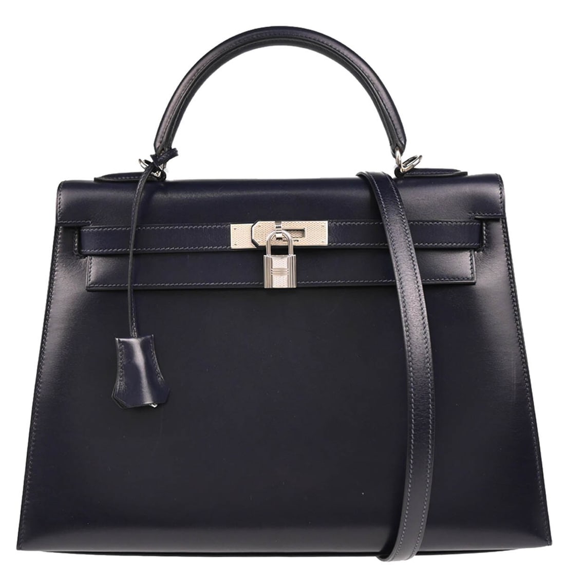 Hermes Navy Box Calf Kelly 32 Top Handle Handbag Silver Hardware: Hermes Navy Box Calf Kelly 32 Top Handle Handbag Silver Hardware Introducing the stunning Hermes Navy Box Calf Kelly 32 Guilloche Sellier Handbag, a classic piece that exudes elegance and sophisticati