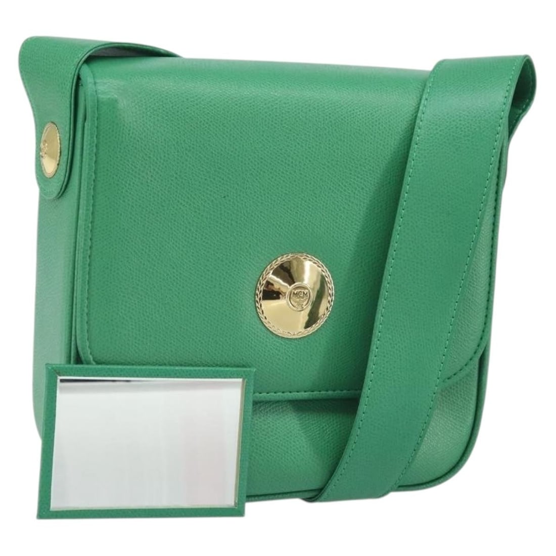 MCM Green Leather Shoulder Bag with Gold Accents and Mirror: MCM Green Leather Shoulder Bag with Gold Accents and Mirror This MCM shoulder bag is crafted from green leather with gold accents. It features a structured silhouette with a top flap, an adjustable sh