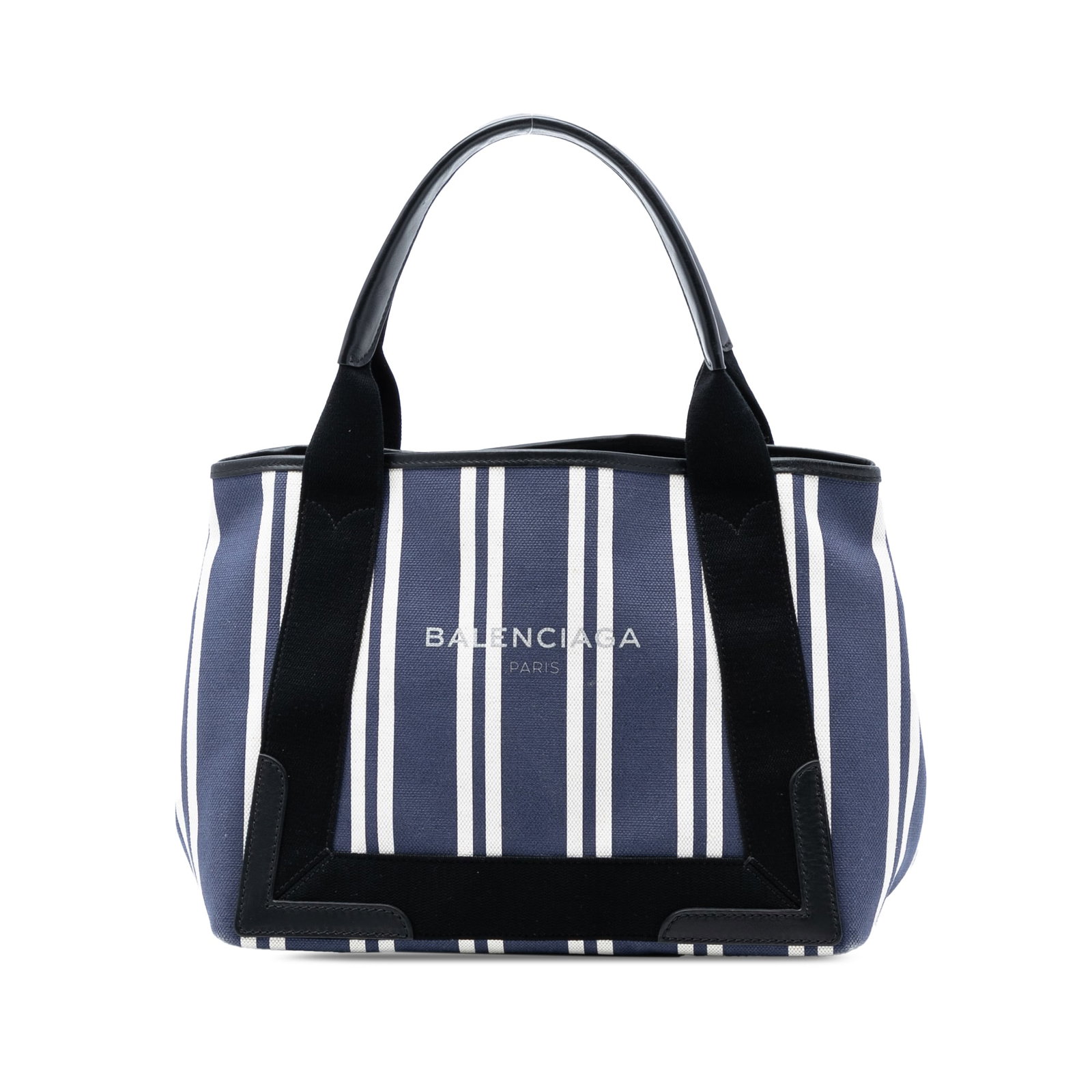 Balenciaga Navy Canvas Striped Cabas S Tote with Leather Handles: Balenciaga Navy Canvas Striped Cabas S Tote with Leather Handles This Balenciaga Canvas Striped Navy Cabas S features a blue striped canvas body with flat leather handles and an open top secured by a 