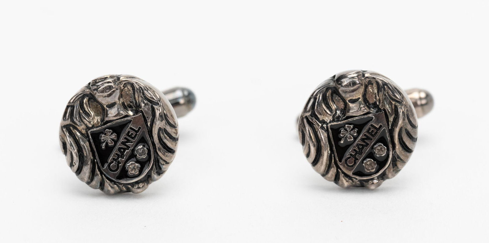 Chanel Sterling Silver Crest Cufflinks Set of 2 2000: Chanel Sterling Silver Crest Cufflinks Set of 2 2000 Elevate your formal attire with these exquisite Chanel Sterling Silver Logo Crest Cufflinks. Featuring a distinctive crest logo design, these cuffl