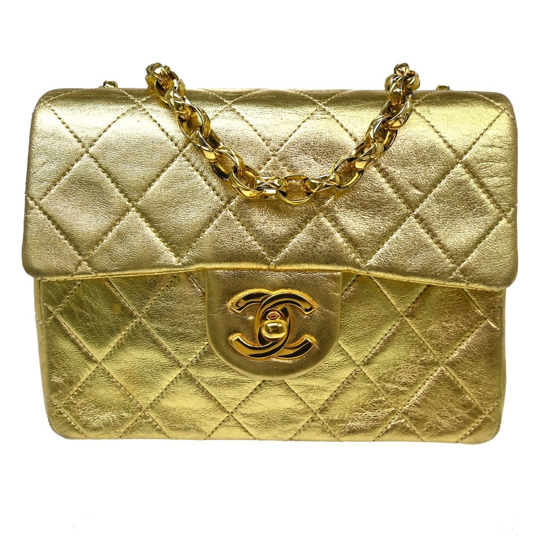 CHANEL Classic Flap Gold Lambskin Crossbody Bag: CHANEL Classic Flap Gold Lambskin Crossbody Bag This Chanel Classic Square Flap Shoulder Bag features luxurious gold lambskin leather with a signature matelasse quilted pattern. The bag is designed wi
