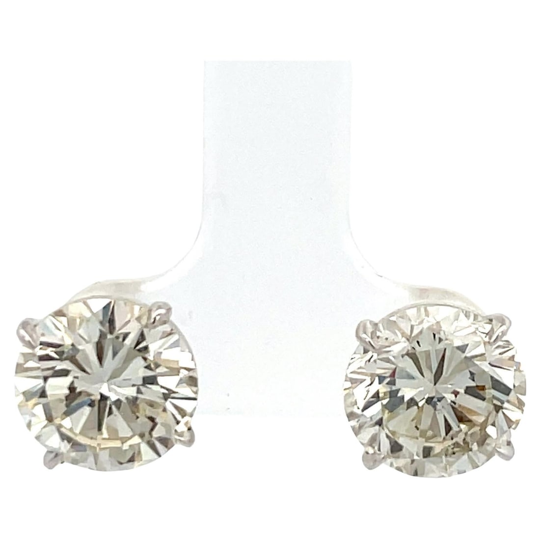 Harbor Diamonds 7.00ct J-K SI1 Diamond Stud Earrings in 18K White Gold Martini Setting: Harbor Diamonds 7.00ct J-K SI1 Diamond Stud Earrings in 18K White Gold Martini Setting These stunning diamond stud earrings feature a contemporary design, showcasing 7.00 carats of radiant round cut d