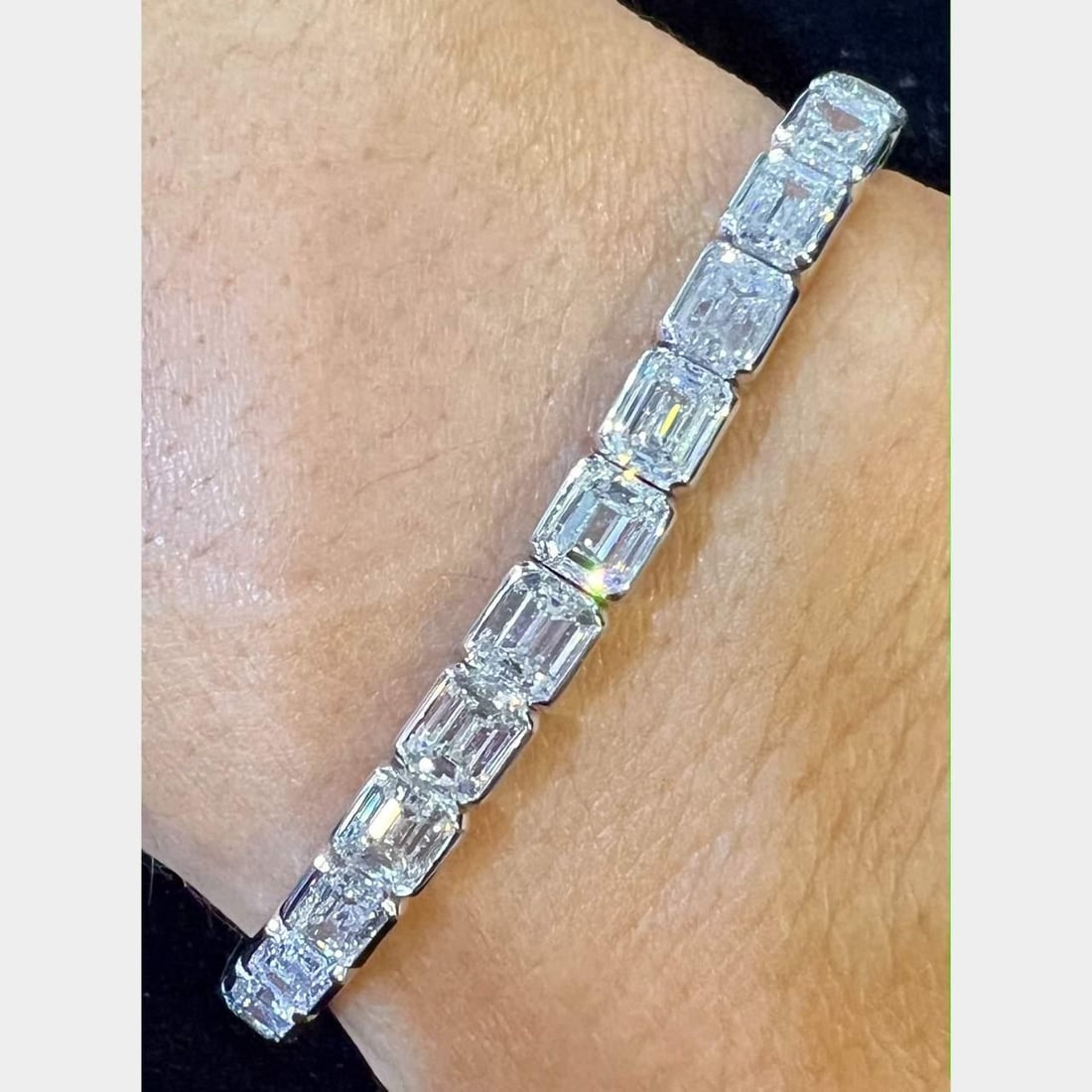Platinum 16.83 Ct Emerald-Cut Diamond Tennis Bracelet 34 Diamonds: Platinum 16.83 Ct Emerald-Cut Diamond Tennis Bracelet 34 Diamonds This exquisite diamond tennis bracelet features a stunning arrangement of 34 emerald-cut diamonds, totaling 16.83 carats. Crafted in l