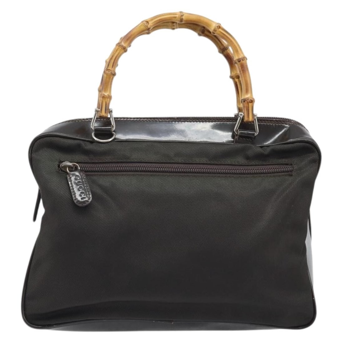 Gucci Brown Nylon Vintage Tote with Bamboo Top Handle: Gucci Brown Nylon Vintage Tote with Bamboo Top Handle This Gucci Vintage Bamboo Handle Bag features a brown nylon exterior with signature bamboo handles. The bag is designed for women and offers a ble