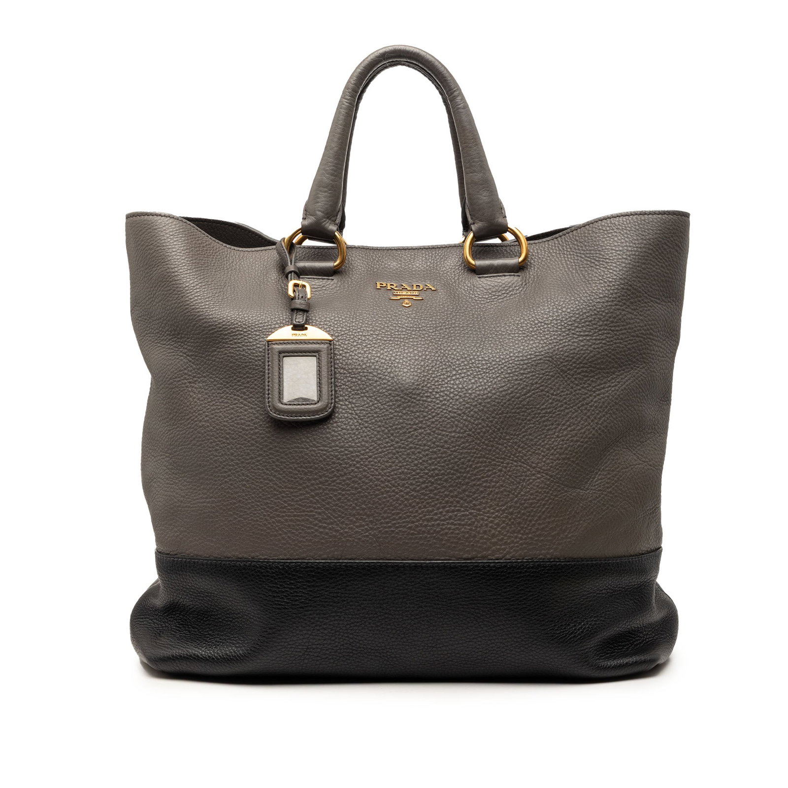 Prada Bicolor Vitello Daino leather convertible tote bag: Prada Bicolor Vitello Daino leather convertible tote bag This Prada Bicolor Vitello Daino Open Convertible Tote is crafted from leather and features rolled leather handles, an open top with a snap but