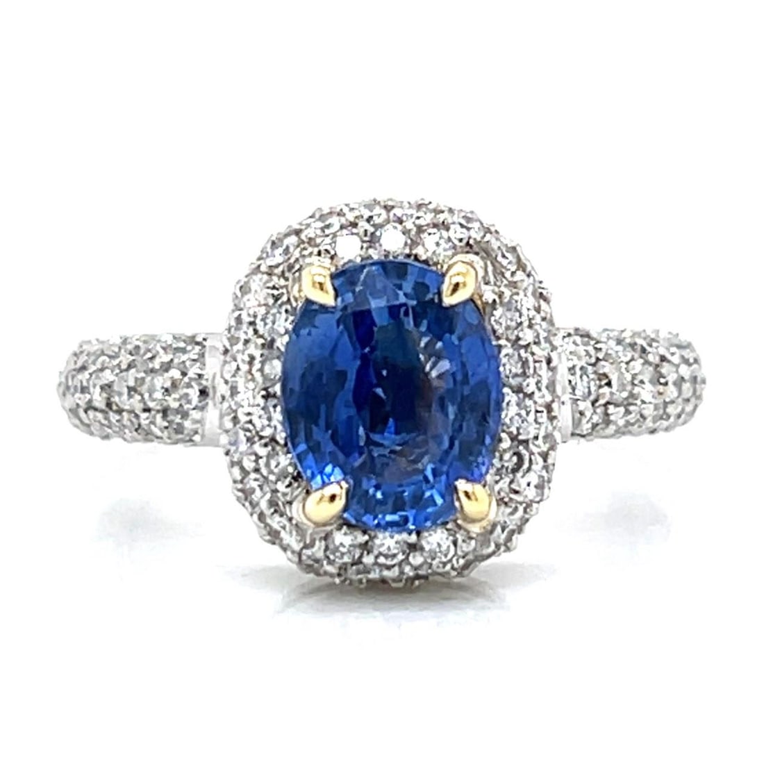 Sapphire and Diamond Ring in Platinum and 18K Gold Size 7: Sapphire and Diamond Ring in Platinum and 18K Gold Size 7 This ring features a blend of platinum and 18K yellow gold, set with a 2.10 carat sapphire and approximately 2.25 carats of diamonds. The diam
