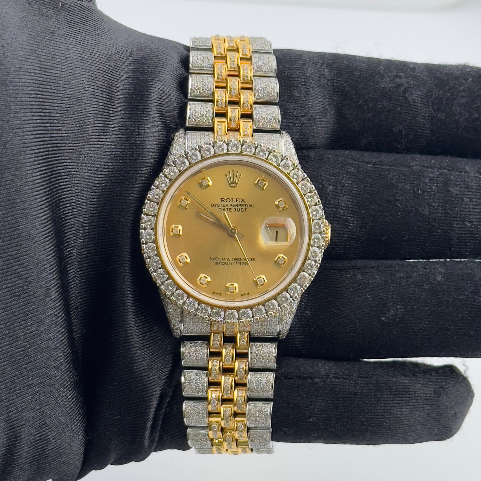 Rolex Datejust 16013 Men's Watch Champagne Diamond Dial Iced Out Jubilee Bracelet: Rolex Datejust 16013 Men's Watch Champagne Diamond Dial Iced Out Jubilee Bracelet This Rolex Datejust features a champagne diamond dial and a prong-plated bezel. The watch is equipped with an iced out