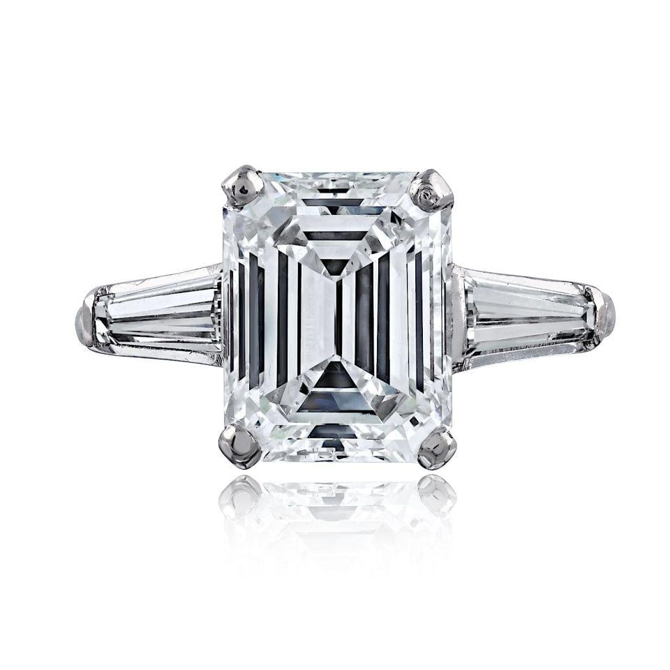 Platinum GIA Emerald Cut Diamond Ring H VS2 4.04 Carats: Platinum GIA Emerald Cut Diamond Ring H VS2 4.04 Carats This elegant ring features a 4.04 carat emerald cut diamond set in platinum. The diamond is graded H color and VS2 clarity, offering a beautiful