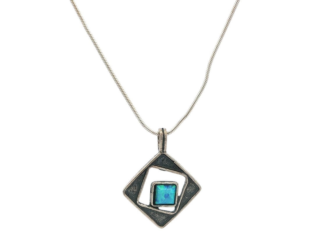 Handmade Sterling Silver Opal Geometric Pendant Necklace 16.5 in: Handmade Sterling Silver Opal Geometric Pendant Necklace 16.5 in This exquisite handmade pendant necklace features a stunning square cabochon opal, showcasing a captivating blue base with green color 