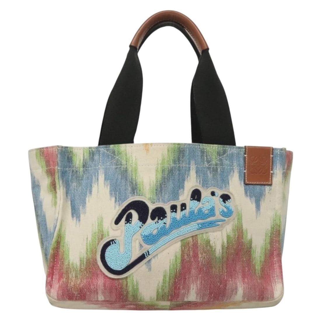 Paula's Ibiza Canvas Tote Bag by Loewe Multicolour: Paula's Ibiza Canvas Tote Bag by Loewe Multicolour This Loewe Paula's Ibiza Tote features a vibrant multicolor printed canvas design. The tote is crafted for women and offers ample space for daily ess