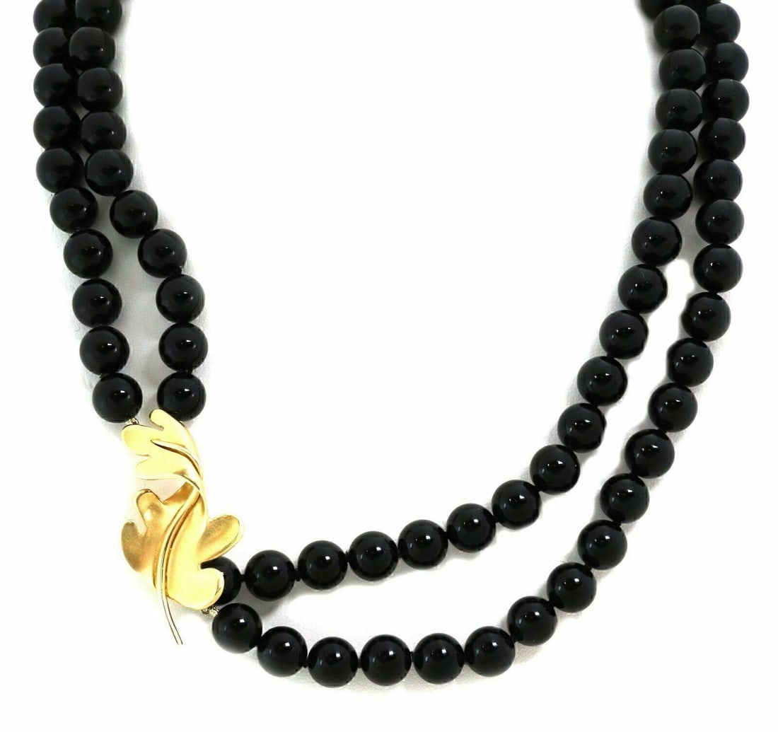 Tiffany & Co. 18k Gold Onyx Bead Oak Leaf Enhancer Necklace: Tiffany & Co. 18k Gold Onyx Bead Oak Leaf Enhancer Necklace This vintage Tiffany & Co. enhancer necklace features bold black onyx beads and an elegant oak leaf motif, all crafted in luxurious 18k yell