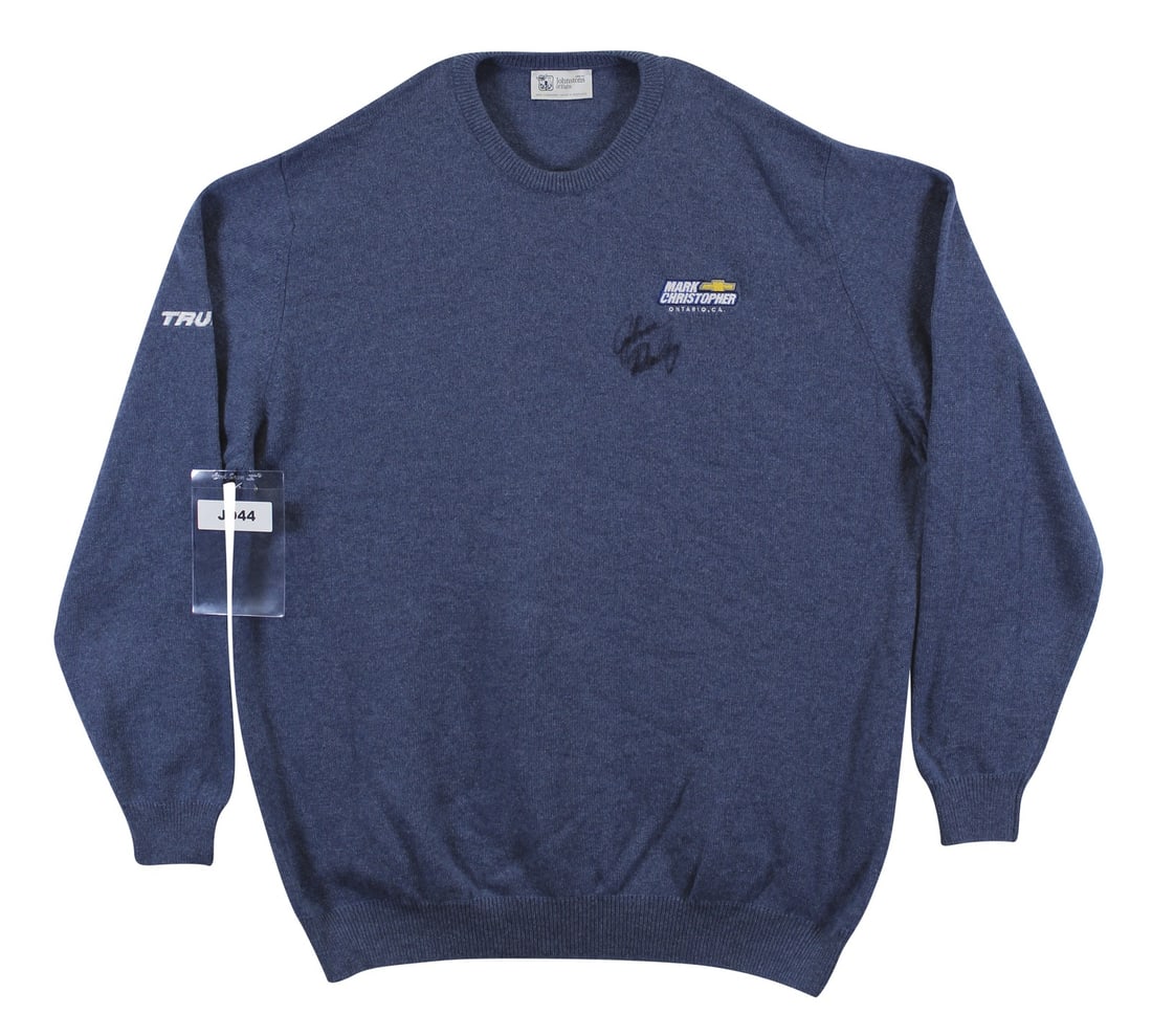 John Daly Signed Match Worn Blue Cashmere Sweater Beckett Authenticated: John Daly Signed Match Worn Blue Cashmere Sweater Beckett Authenticated This authentic match worn cashmere sweater from Johnstons of Elgin has been personally signed by professional golfer John Daly. 