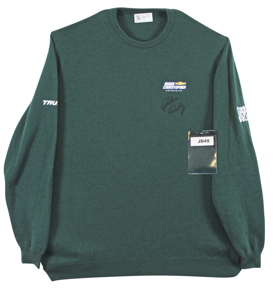Match Worn Cashmere Golf Sweater Signed by John Daly Beckett Authenticated: Match Worn Cashmere Golf Sweater Signed by John Daly Beckett Authenticated This dark green Johnstons of Elgin cashmere sweater was worn by professional golfer John Daly during a match and has been per