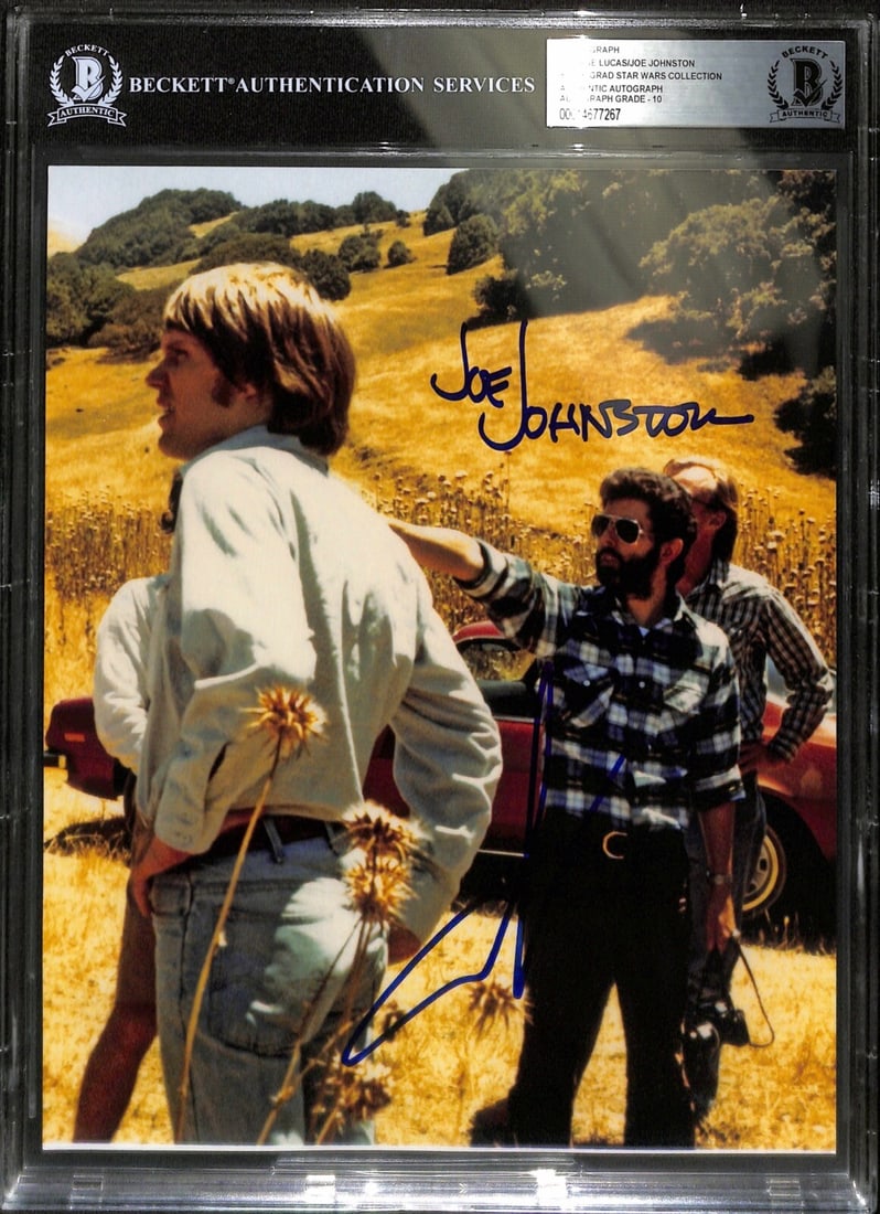 8x10 Photo Signed by George Lucas and Joe Johnston Beckett Graded 10: 8x10 Photo Signed by George Lucas and Joe Johnston Beckett Graded 10 This is an original 8x10 photograph autographed by George Lucas and Joe Johnston. The signatures are in blue permanent marker. The 