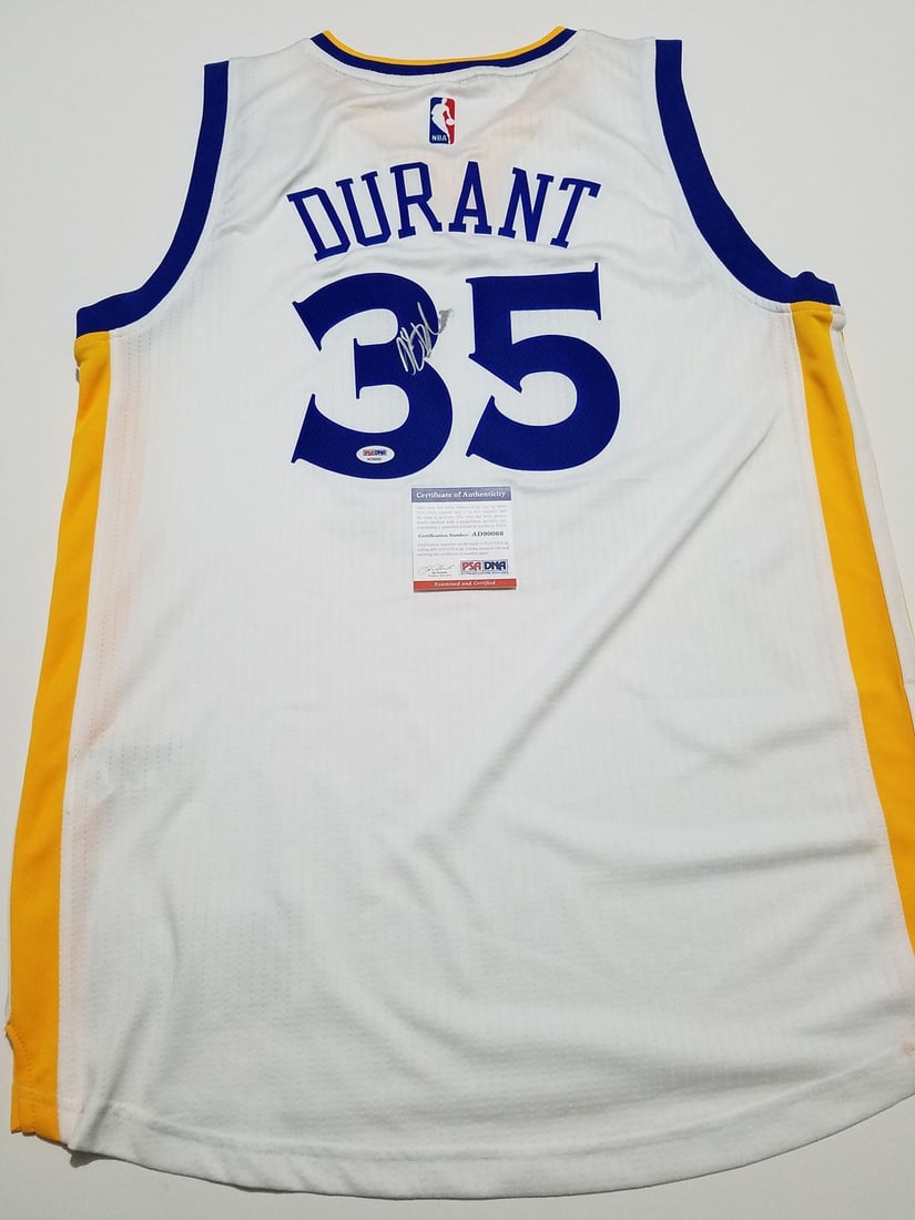 PSA DNA authenticated Kevin Durant Warriors signed stitched jersey: PSA DNA authenticated Kevin Durant Warriors signed stitched jersey This is a pre-owned Golden State Warriors jersey featuring a stitched design and an authentic autograph by Kevin Durant. The signatur
