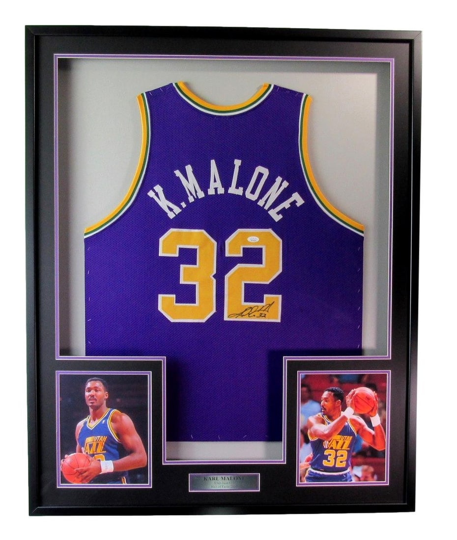 Framed Utah Jazz Jersey Signed by Karl Malone with JSA Authentication: Framed Utah Jazz Jersey Signed by Karl Malone with JSA Authentication This framed Utah Jazz jersey is autographed by Karl Malone and includes accompanying photos. The jersey has been authenticated by 
